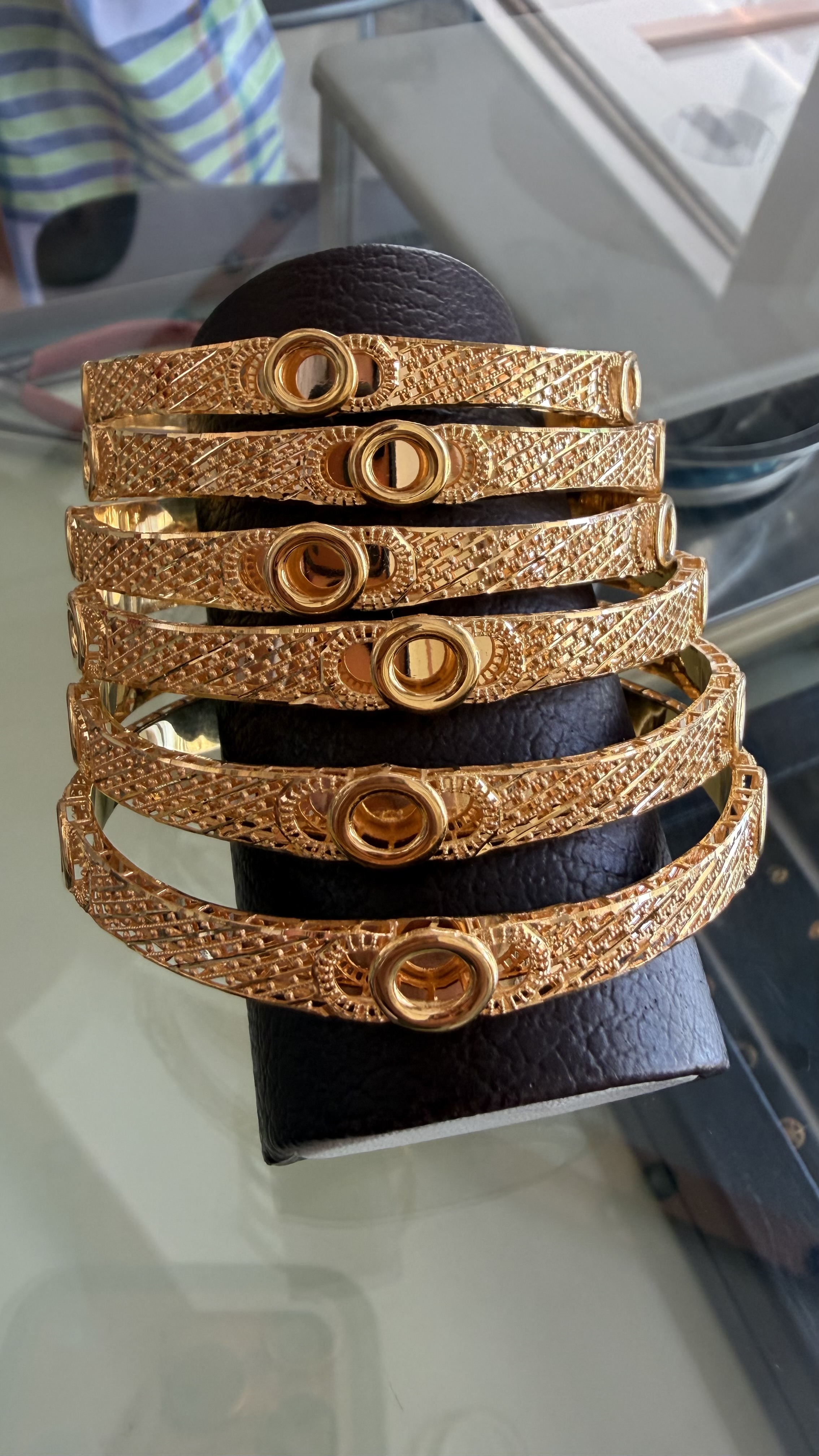 Elegant 6-Piece Textured Gold Bangle Set with Central Ring Motif - Image 3