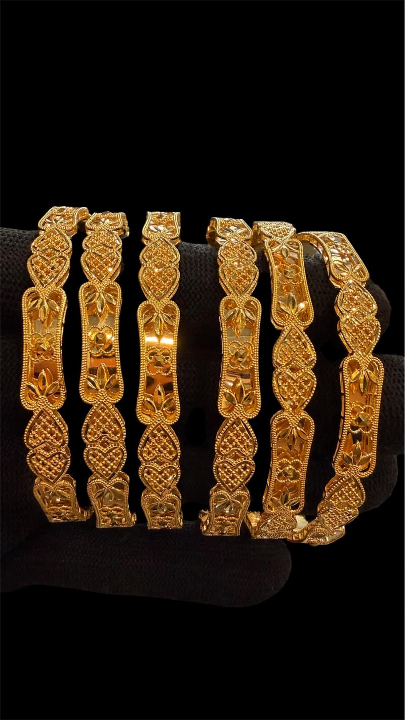 Exquisite Handcrafted Gold Bangle Set with Heart and Floral Motifs